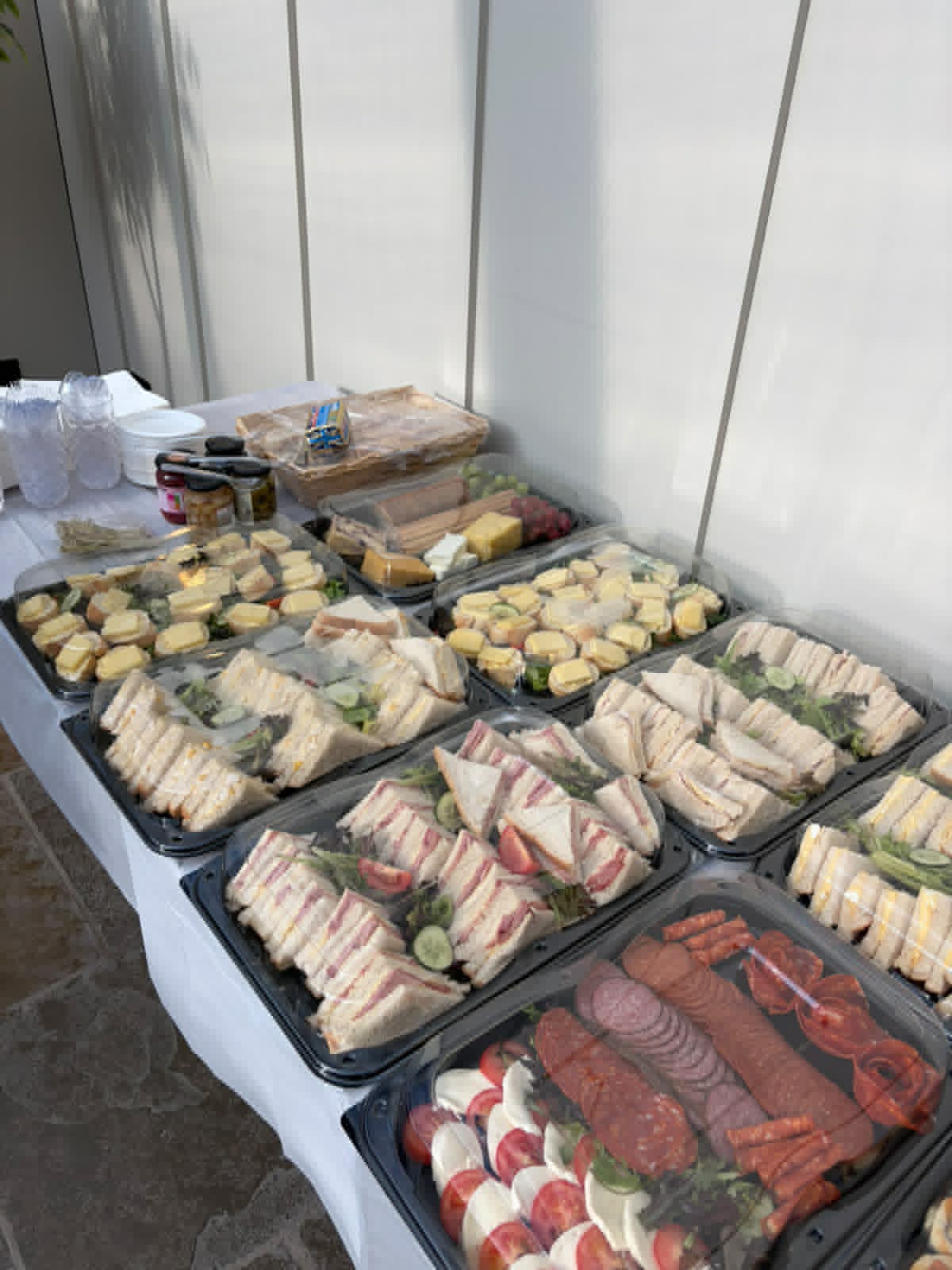 Cold finger buffet of sandwiches, wraps and antipasti platters