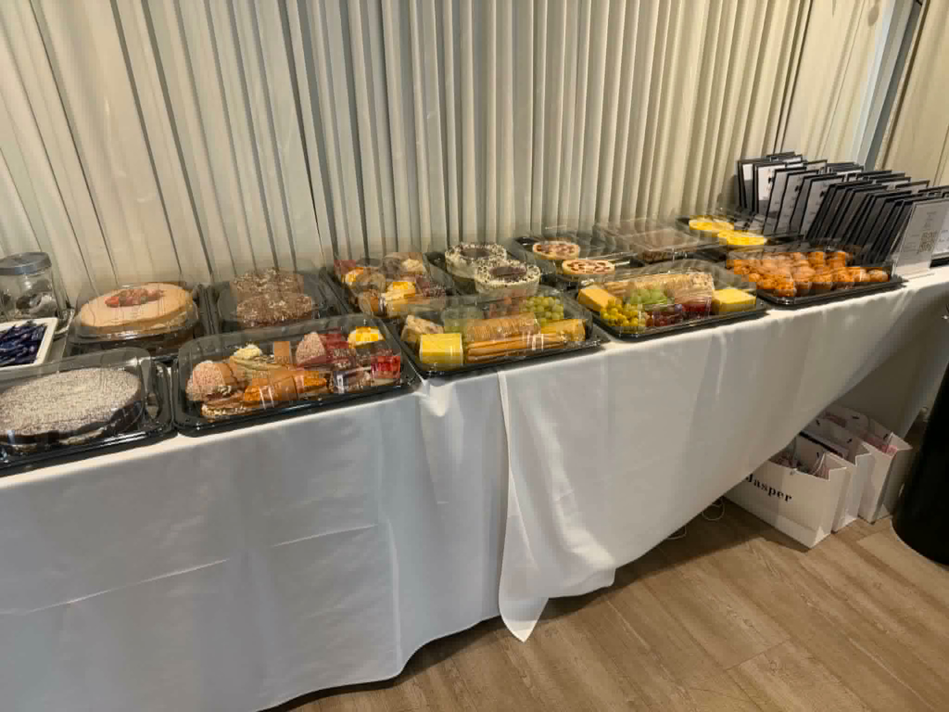 Afternoon tea style spread with cakes, cheese and fruit platters