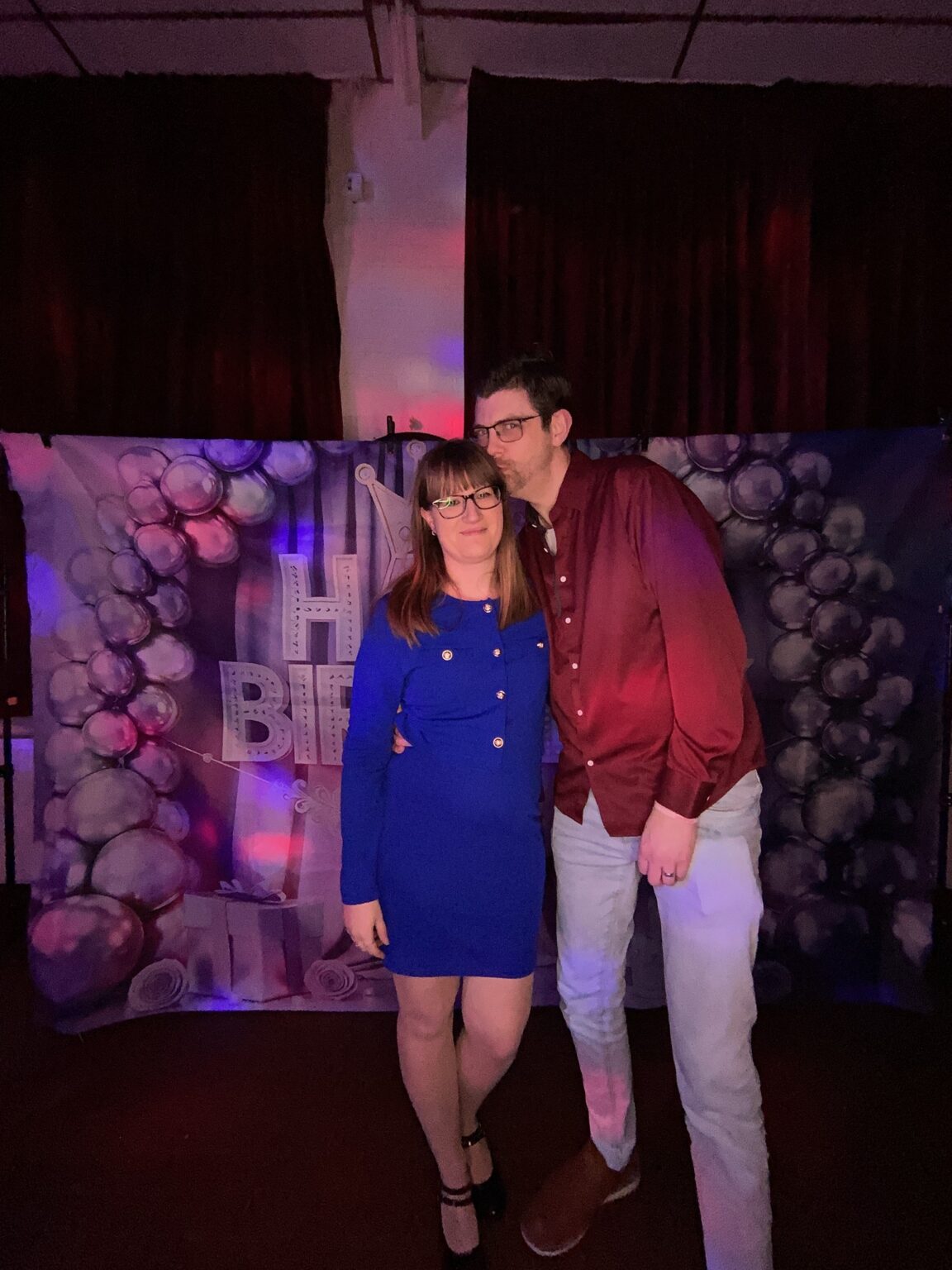 Party guests in front of the balloon wall